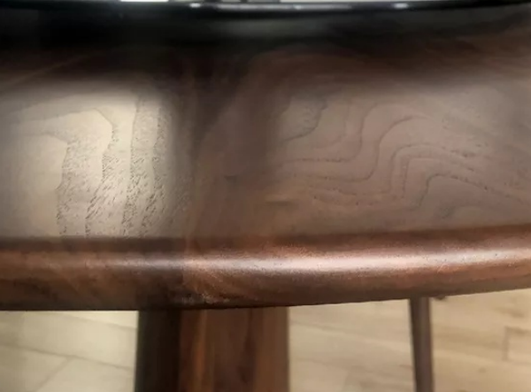 Round edges of the black walnut wood tables